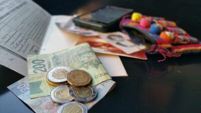 Photo of money, papers, and cellphone