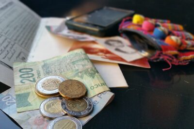 Photo of money, papers, and cellphone