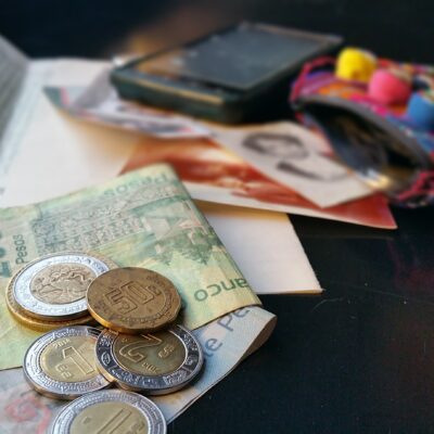 Photo of money, papers, and cellphone