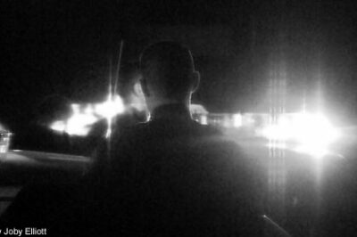 Silhouette of Albuquerque police officer at night