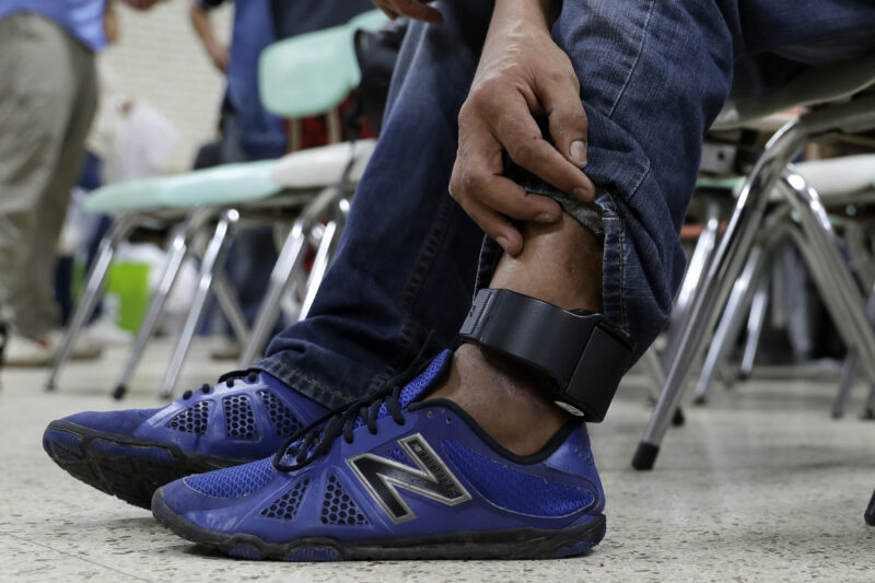 Image of an ankle monitor being worn