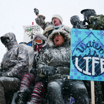Water protectors and vets protest the Dakota Access Pipeline.