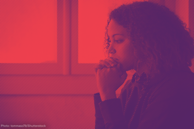 Woman with hands clasped in front of her