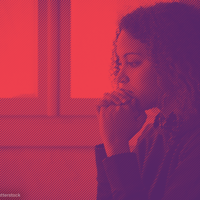 Woman with hands clasped in front of her