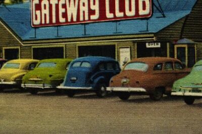 Old postcard of cars in parking lot