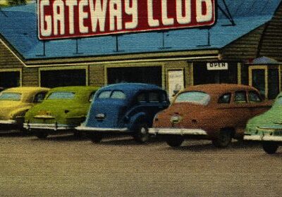 Old postcard of cars in parking lot
