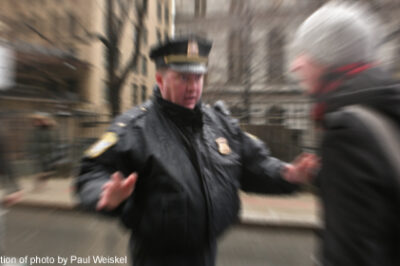 Photo of police officer speaking to civilian