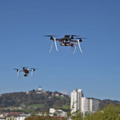 Two drones hovering in air