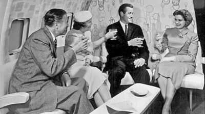 Four people enjoying vintage airline lounge