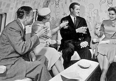 Four people enjoying vintage airline lounge