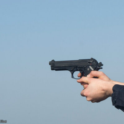 Picture of a gun in a man's hands