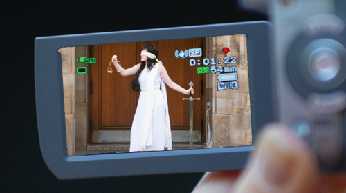 Image of Lady Justice on camcorder screen