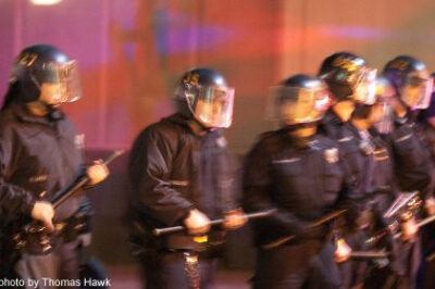 Photo of police standing with batons