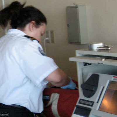 TSA agent searching bag
