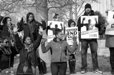 #BlackLivesMatter protesters holding ACLU signs