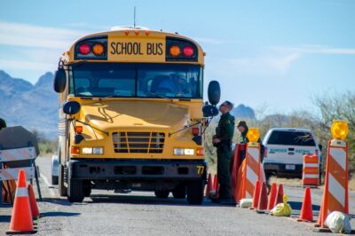 Border Patrol stops school bus at a checkpoint.