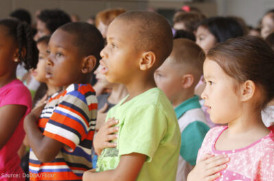 Students pledge allegiance to the flag.