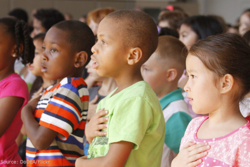 Students pledge allegiance to the flag.