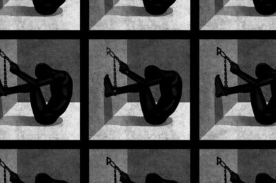 silouette of man chained to wall in solitary