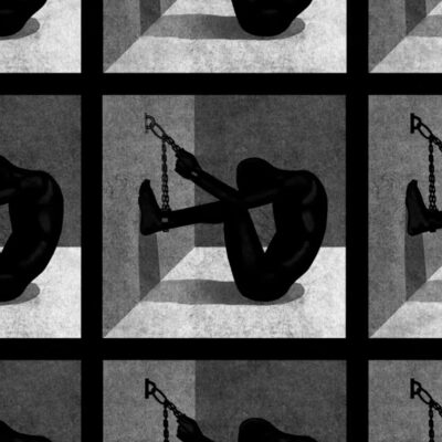 silouette of man chained to wall in solitary