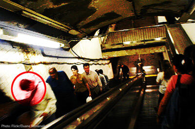 Man being profiled on escalator