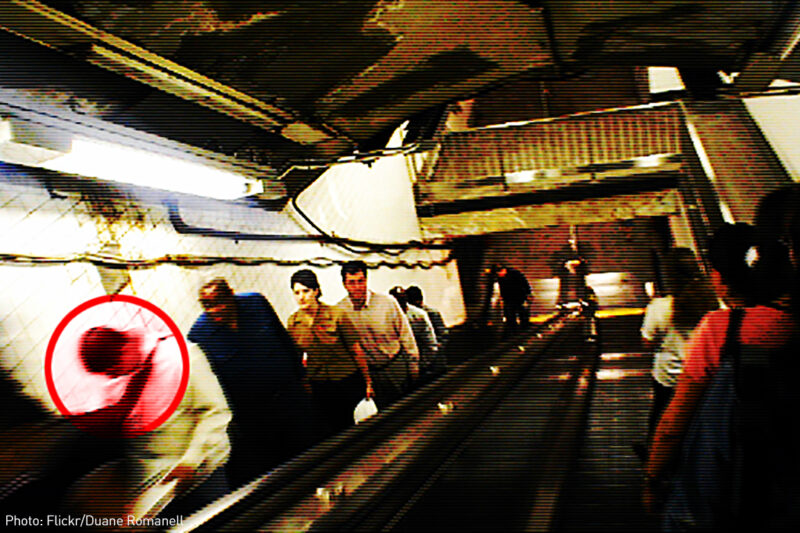 Man being profiled on escalator