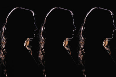 Silhouettes of women back to back