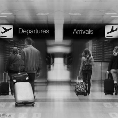 Travelers walking through airport