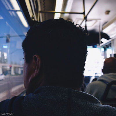 Man Looking Out Bus Window