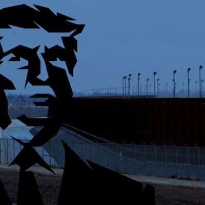 Donald Trump silhouette in front of border fence