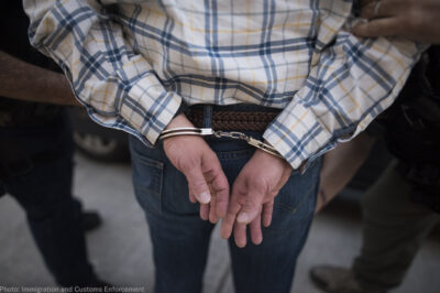 A man handcuffed from behind