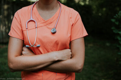 Doctor with arms folded looking defiant