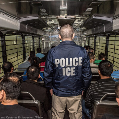 ICE agent on a bus