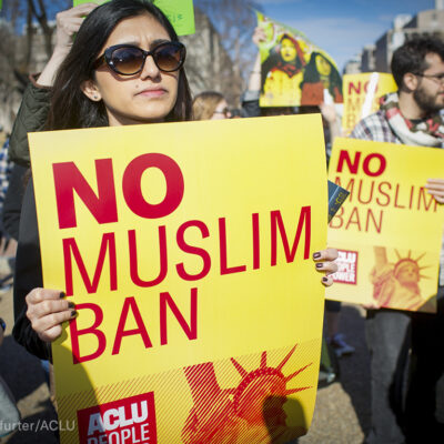 "No Muslim Ban" signs at a rally
