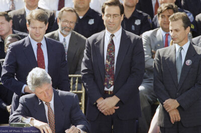 President Bill Clinton signs the $30 billion crime bill during a ceremony on the South Lawn of the White House in Washington on Sept. 13, 1994
