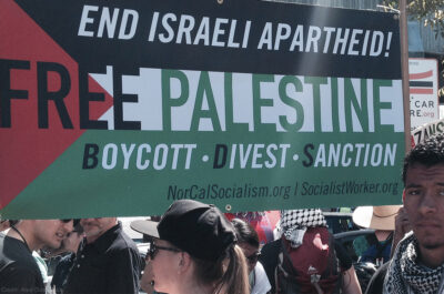 Protest with Free Palestine Boycott Divest Sanction Banner