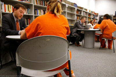 Public defender meeting with jailed client