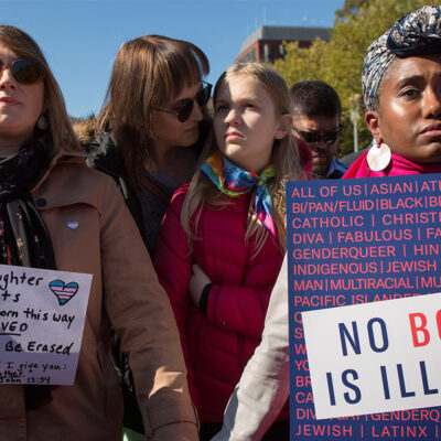 Protesters marching in favor of the rights of trans people