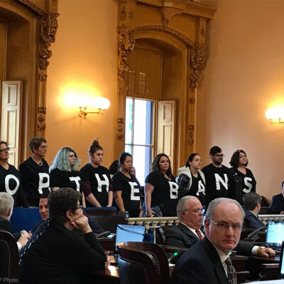 Pro-choice activists stand in protest in the Ohio Senate chamber
