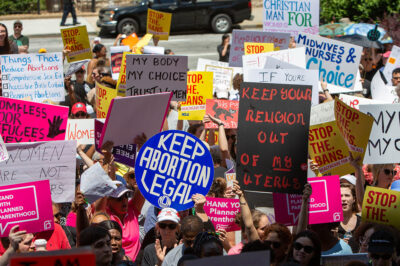 Demonstrators marching against bans on abortion