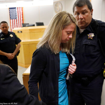 Holding a Bible given to her by State District Judge Tammy Kent, former Dallas Police Officer Amber Guyger leaves court for jail following her sentencing