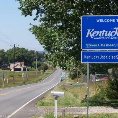 A Welcome to Kentucky road sign with the name of Governor Steven L. Brashear