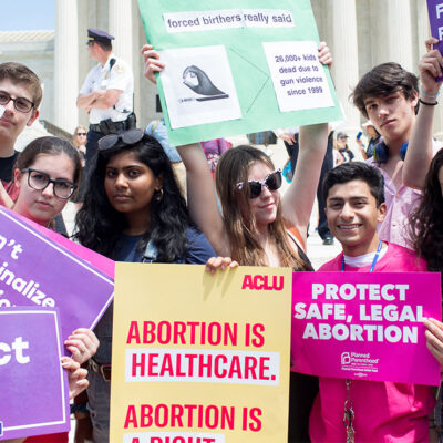 Pro-choice demonstrators with signs advocating the protection of the right to a safe abortion and that abortion is healthcare.