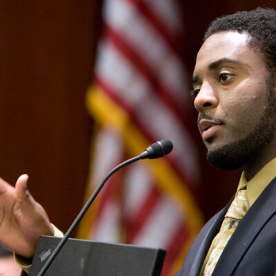 R. Dwyane Betts, program director of the DC creative writing workshop, speaks during a forum.