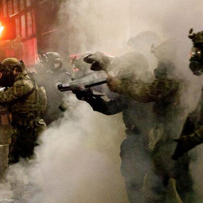 Federal officers open fire on demonstrators with 'less-lethal' weapons, as demonstrators protest against police brutality.