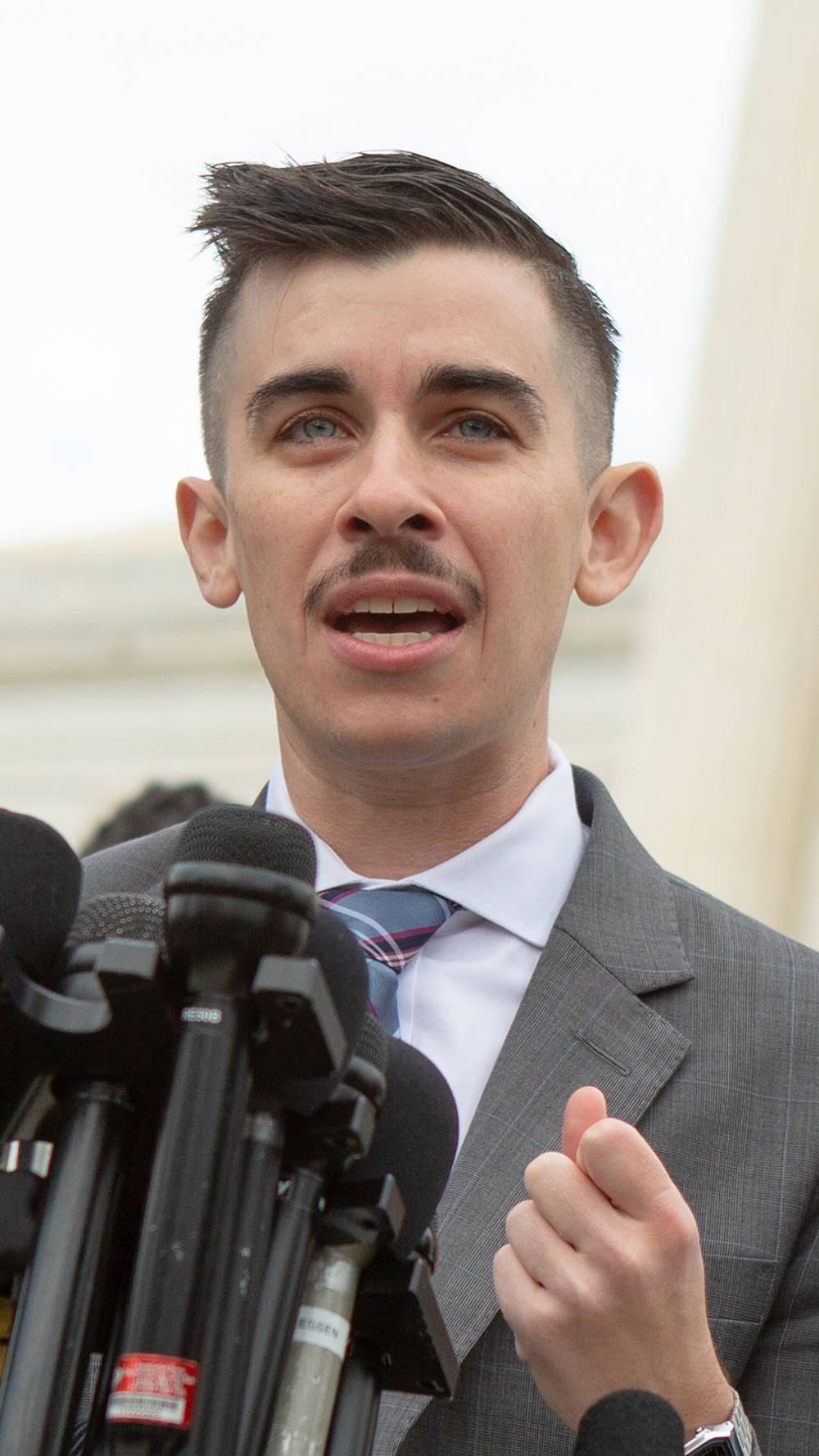 ACLU lawyer Chase Strangio speaking outside the Supreme Court.