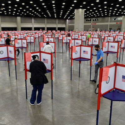 Photo of multiple voting stations set up in the Kentucky Exposition Center for voters to cast their ballot.