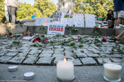 Candle laid at an altar in memory of trans lives lost.
