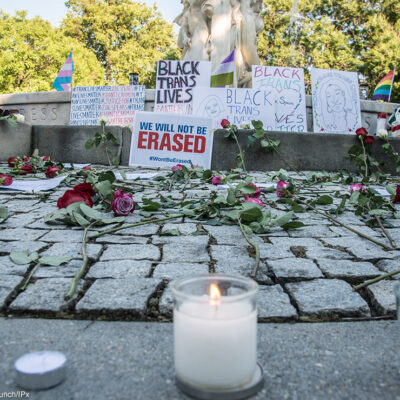 Candle laid at an altar in memory of trans lives lost.