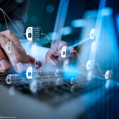 Blockchain technology concept with diagram of chain and encrypted blocks over someone typing on laptop in background